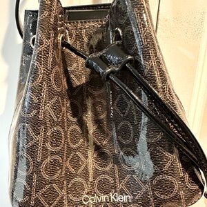 Calvin Klein small bucket crossbody bag in brown